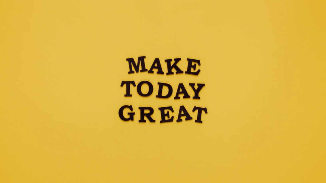 Simple and motivational quote 'Make Today Great' on a minimalist yellow background for inspiration.